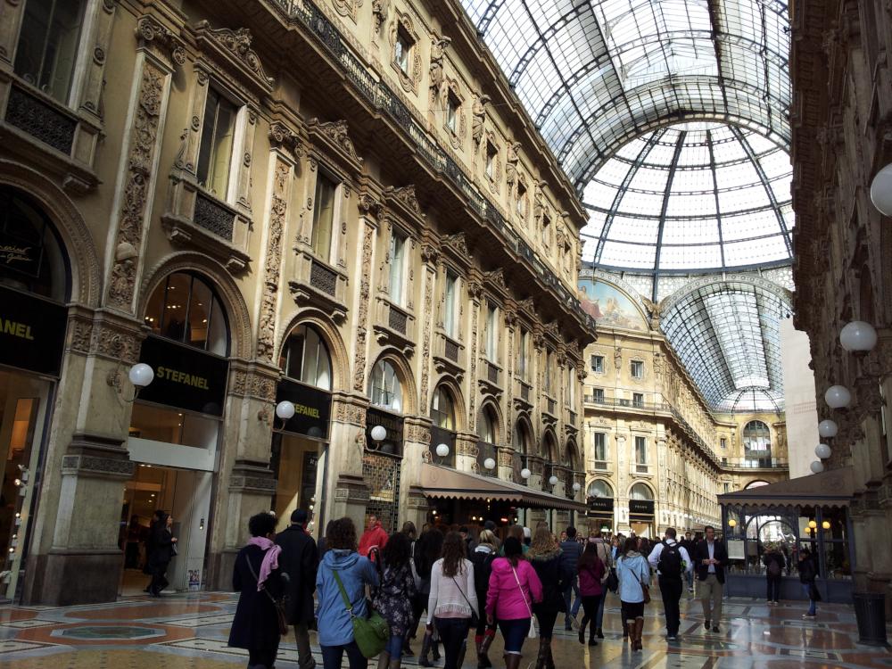 Look up & around and enjoy the 19th century iron-and-glass arcade architecture at Galleria Vittorio Emanuele II in Milan